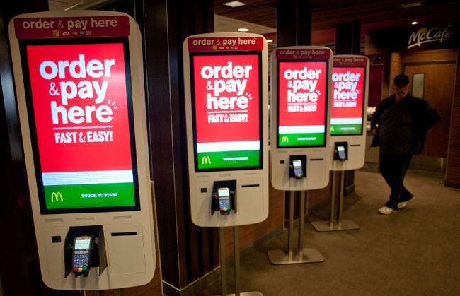 McDonald’s introduces cash-accepting kiosks as labor costs rise